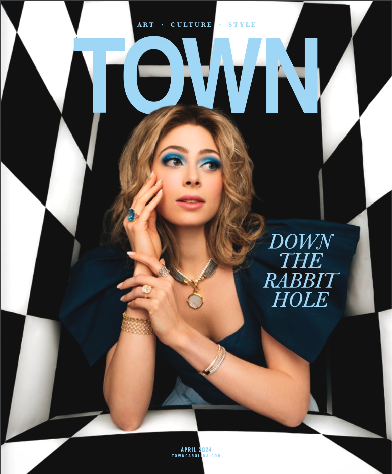 Magazine cover featuring a woman with blonde hair and bold blue eye makeup, dressed in blue, posing in a black and white checkered room. The magazine is titled 'TOWN' with the headline 'DOWN THE RABBIT HOLE' and is dated April 2024.